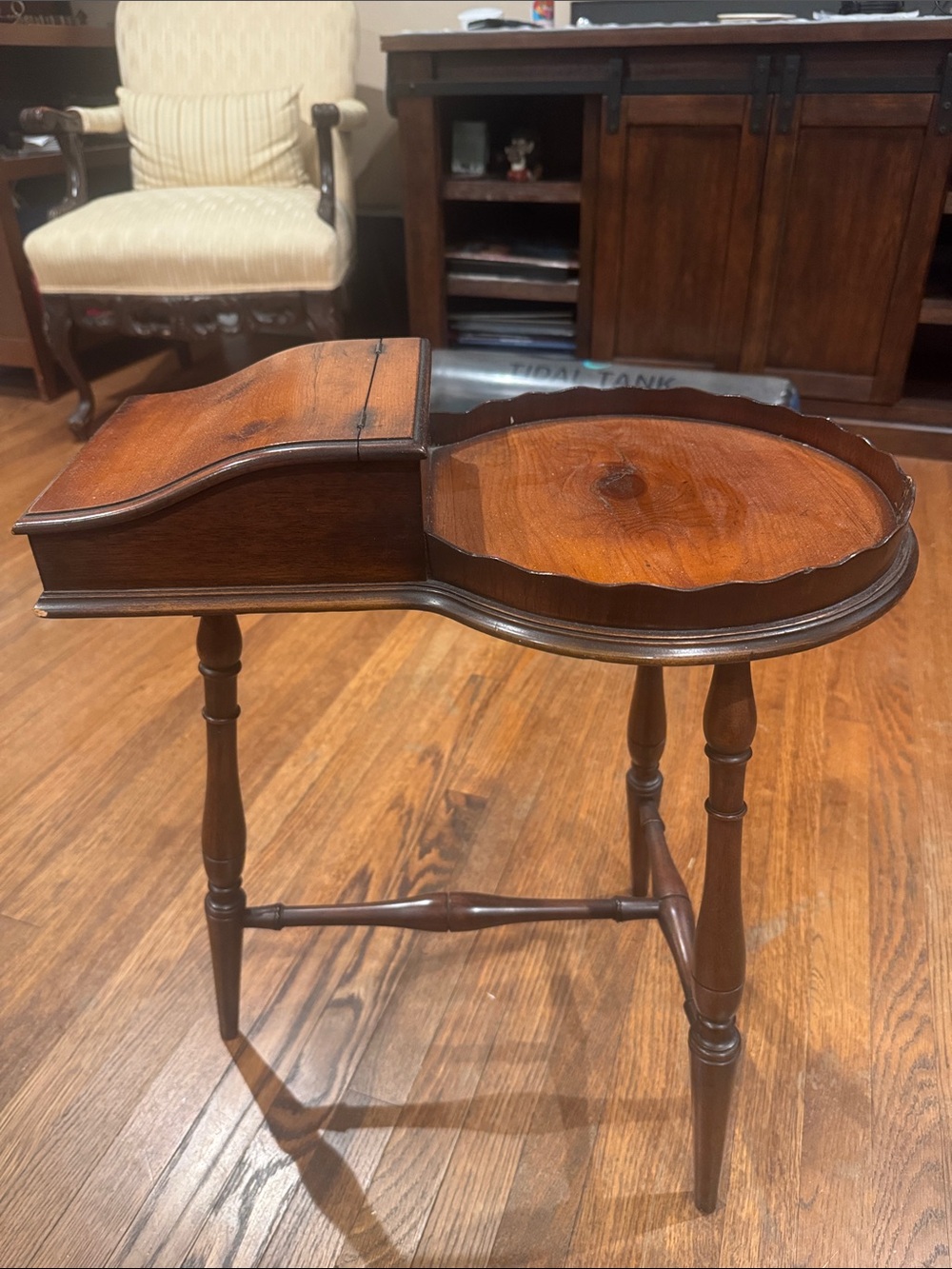 Vintage Walnut stand with tilt top and scalloped edge.